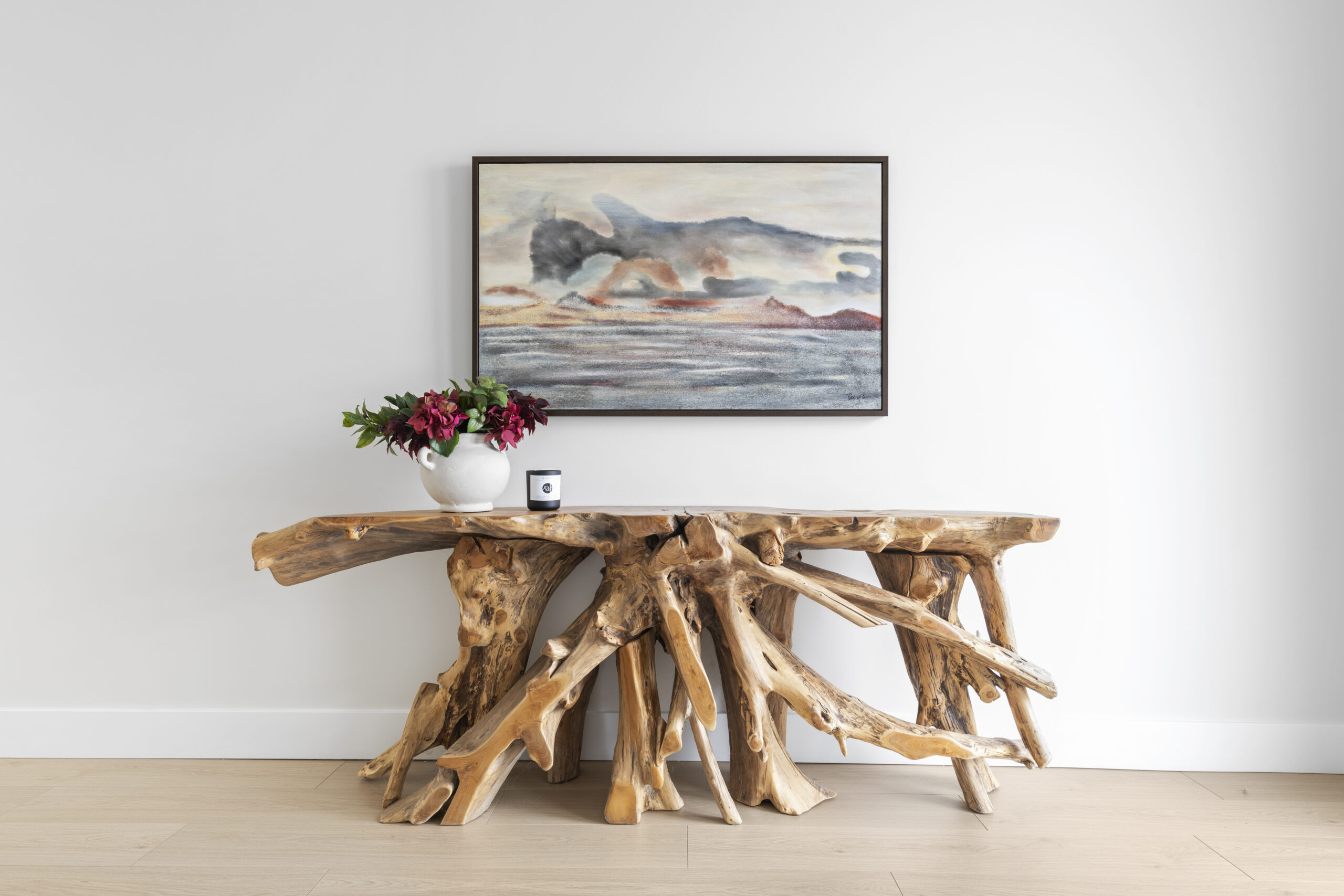 Photo By: Jody Wall Photography Driftwood table with painting on wall